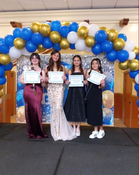  Students posing with their certificates
